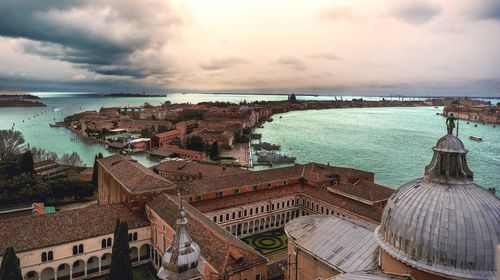 High angle view of city against cloudy sky