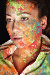 Close-up portrait of a young woman whith holi