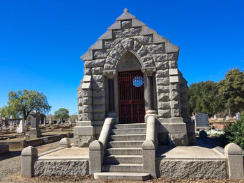 Low angle view of church against clear blue sky