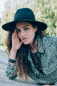 Portrait of beautiful stylish young woman wearing black felt hat millennials generation.