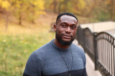 Portrait of young man standing outdoors