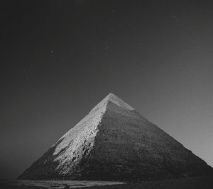 Low angle view of pyramid against sky on sunny day