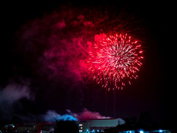 Low angle view of firework display at night