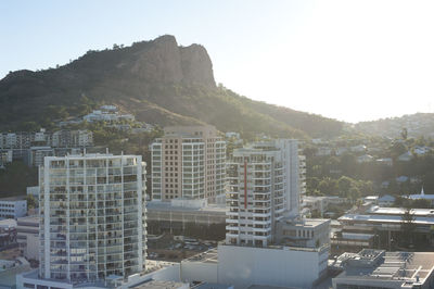 High angle view of buildings in city against clear sky