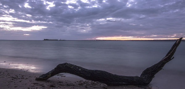 Scenic view of sea against sky at sunset