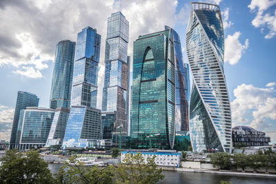 Low angle view of modern buildings against sky in city