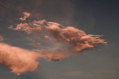 Low angle view of smoke against sky during sunset