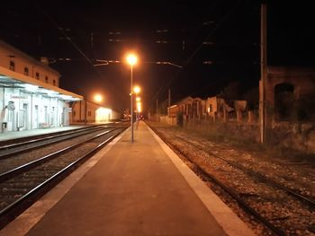 Train at railroad station at night