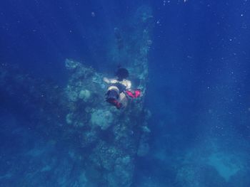 Woman diving underwater