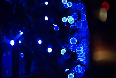 Close-up of illuminated lights at night