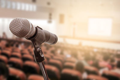 Close-up of microphone in auditorium
