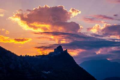 Scenic view of mountains against sky during sunset