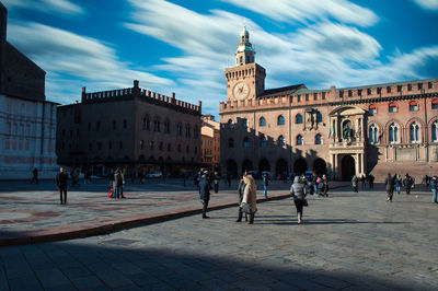 Group of people in town square