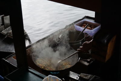 Midsection of man preparing food