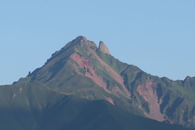 Low angle view of mountains against clear sky