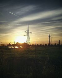 Scenic view of field against sky at sunset