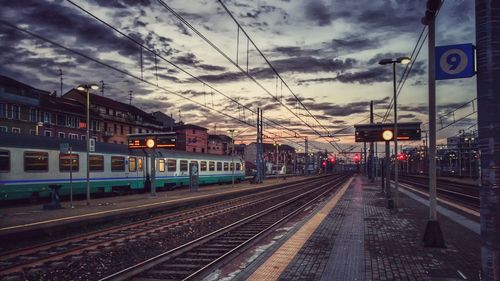 Railroad station against sky in city