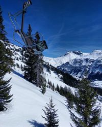 Scenic view of snow covered mountains against sky