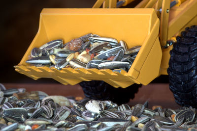 Close-up of yellow garbage on metal