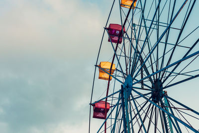 Low angle view of ferris wheel against sky