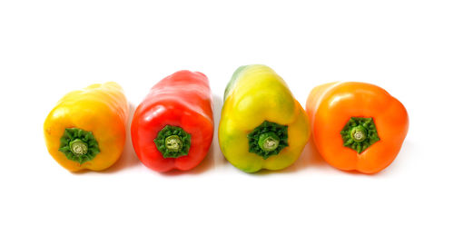 Close-up of bell peppers against white background