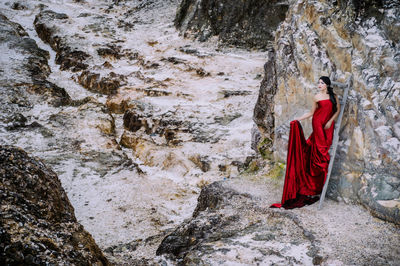 Woman standing on rock