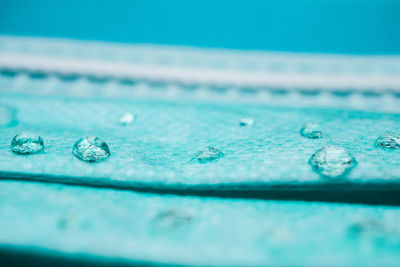 Close-up of water drops on swimming pool