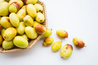 High angle view of fruits in plate on table