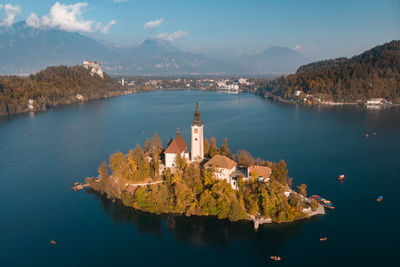 Panoramic view of lake and buildings against sky