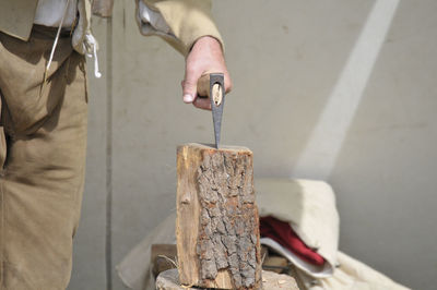 Close-up of man working on wood
