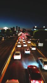 High angle view of light trails on highway at night