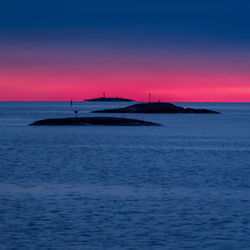 Scenic view of sea against sky at sunset