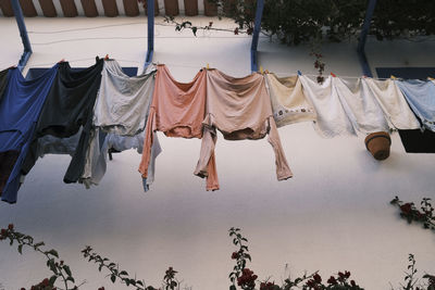 Low angle view of clothes drying on wall
