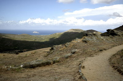 Scenic view of landscape and mountains against sky