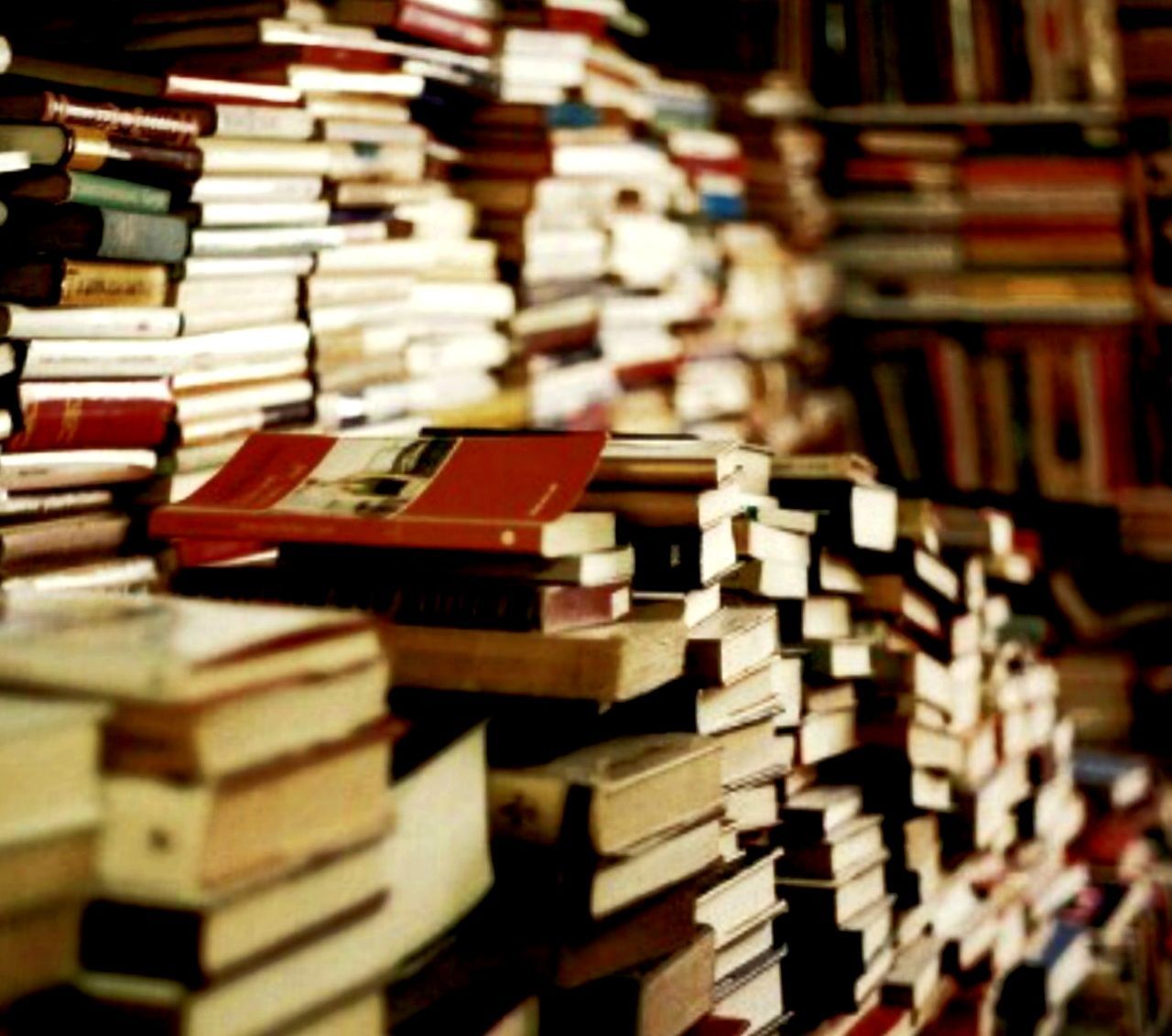 CLOSE-UP OF STACK OF BOOKS