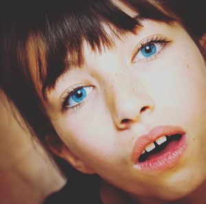 Close-up portrait of girl with blue eyes