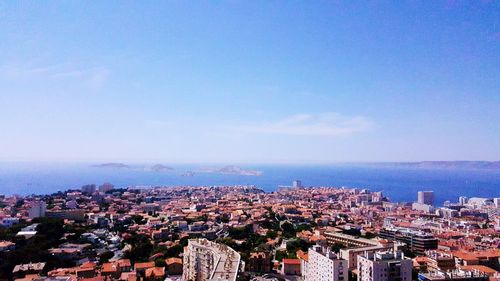 Cityscape against blue sky