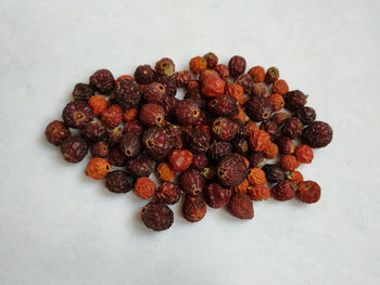 High angle view of coffee beans against white background