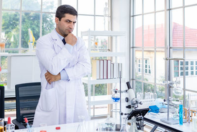 Portrait of doctor standing in laboratory