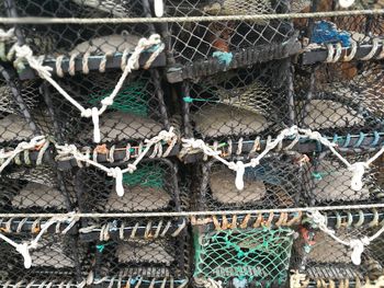 Full frame shot of fishing net in cage