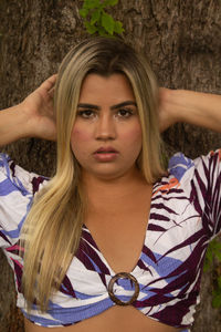 Portrait of young woman in park