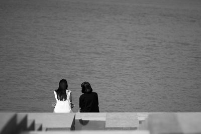 Rear view of people at beach