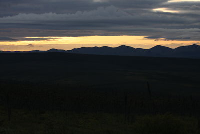 Scenic view of silhouette landscape against sky during sunset