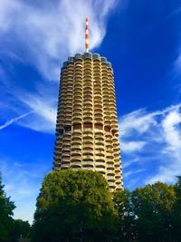 Low angle view of building against cloudy sky