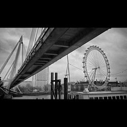 Low angle view of ferris wheel against sky