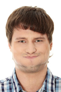 Portrait of smiling young man against white background