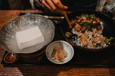 Midsection of man preparing food on table