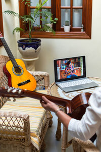 Man using mobile phone at home