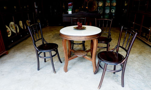 Empty chairs and table in restaurant