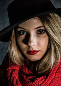 Close-up portrait of woman with hat